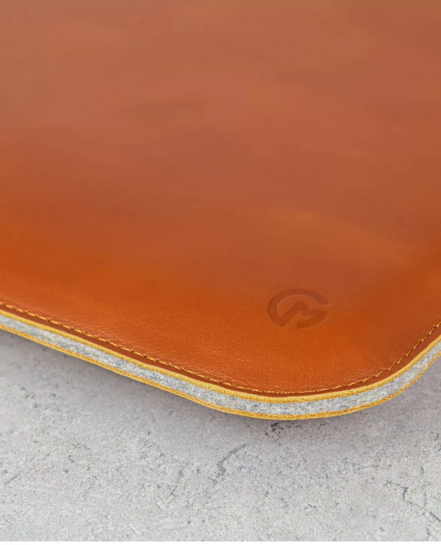 casemade logo on tan leather macbook sleeve