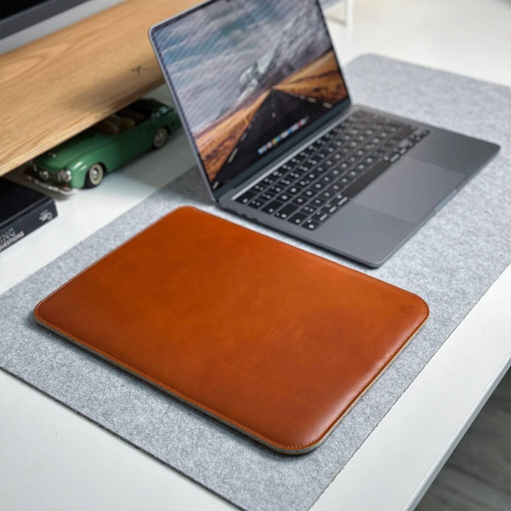 casemade leather laptop sleeve on desk tan brown